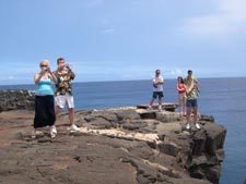 Tourists takign pictures on south point the big island hawaii